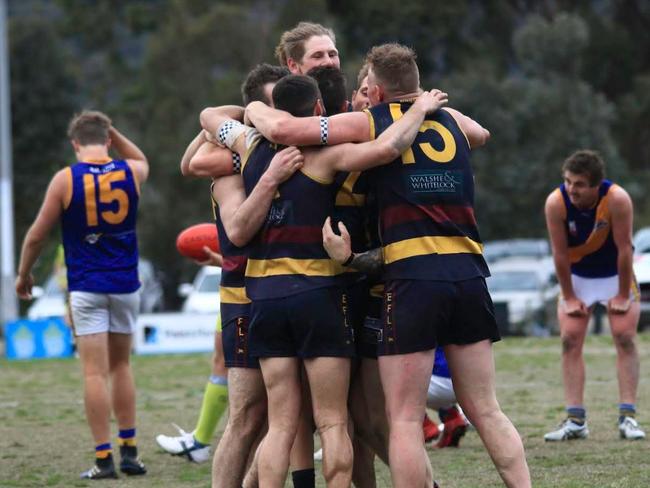 Doncaster East players celebrate on the siren. Picture: Davis Harrigan