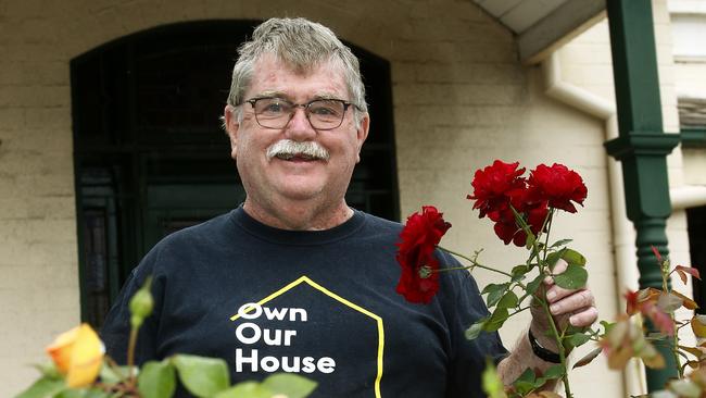 Stephen McAuley with the roses in his garden at his Paddington Home. Picture: John Appleyard