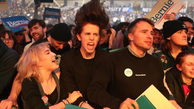 Fans enjoy the Sunflower Bean band perform before Bernie Sanders arrives for his campaign event in Durham, New Hampshire, on Tuesday. Picture: Getty Images