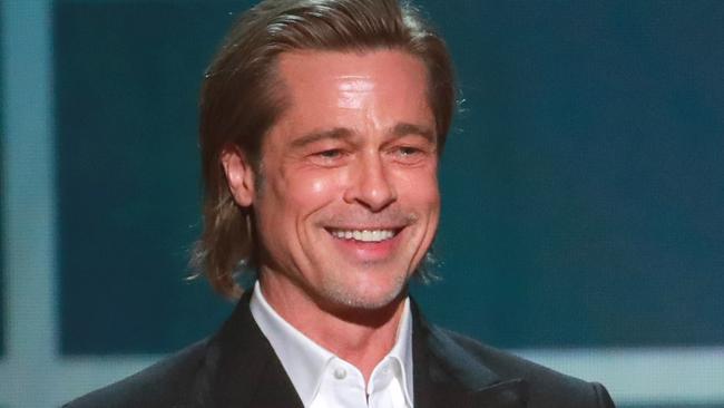 LOS ANGELES, CALIFORNIA - JANUARY 19: Brad Pitt accepts the awards for Outstanding Performance by a Male Actor in a Supporting Role for  
