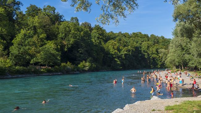 Locals swim in the Aare River on the outskirts of Bern.