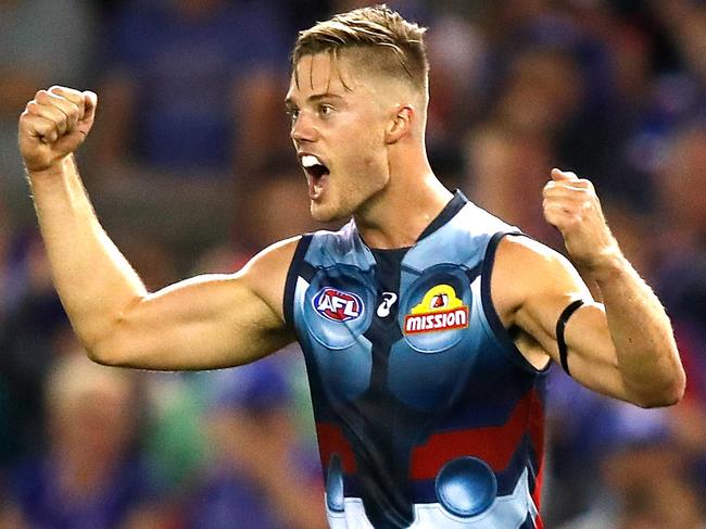 MELBOURNE, AUSTRALIA - MARCH 23: Josh Schache of the Bulldogs celebrates a goal during the 2019 AFL round 01 match between the Western Bulldogs and the Sydney Swans at Marvel Stadium on March 23, 2019 in Melbourne, Australia. (Photo by Dylan Burns/AFL Photos)