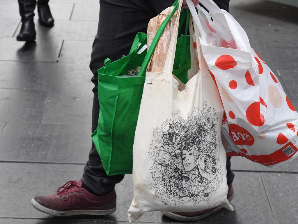 Coles and Woolworths both banned single-use plastic bags last year. Picture: AAP Image/Peter RAE.