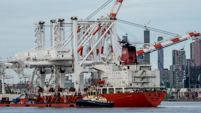 A four-day stoppage will start on Wednesday at Australia’s biggest stevedoring company, DP World. Two cranes being delivered to DP World Australia’s Melbourne terminal last year. Picture: Jake Nowakowski