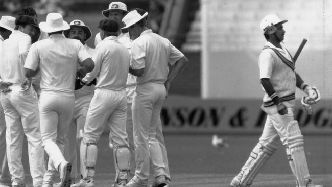 A quick-witted Merv Hughes got the better of Javed Miandad (right).