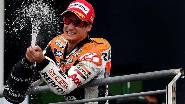 Dani Pedrosa celebrates after winning the German MotoGP at the Sachsenring Circuit