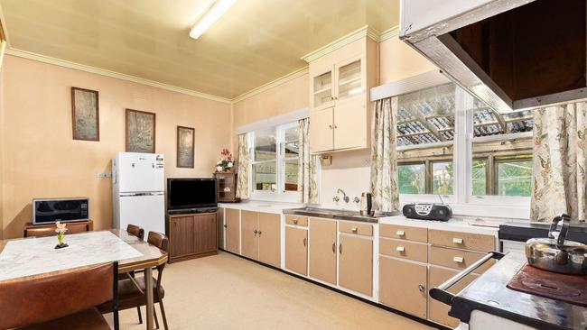 The kitchen has an original stove.