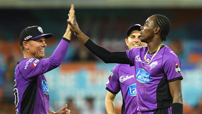 Jofra Archer (right) reacts after taking the wicket of Ben Cutting of the Heat during the Big Bash League (BBL) match between the Brisbane Heat and the Hobart Hurricanes at Metricon Stadium on the Gold Coast. Picture: AAP IMAGE/DAVE HUNT