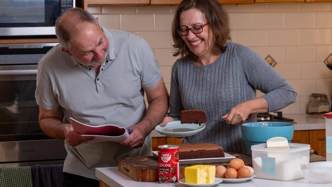 Advertiser food reviewer Simon Wilkinson makes the jailhouse sponge cake with Anne. Photo: Naomi Jellicoe