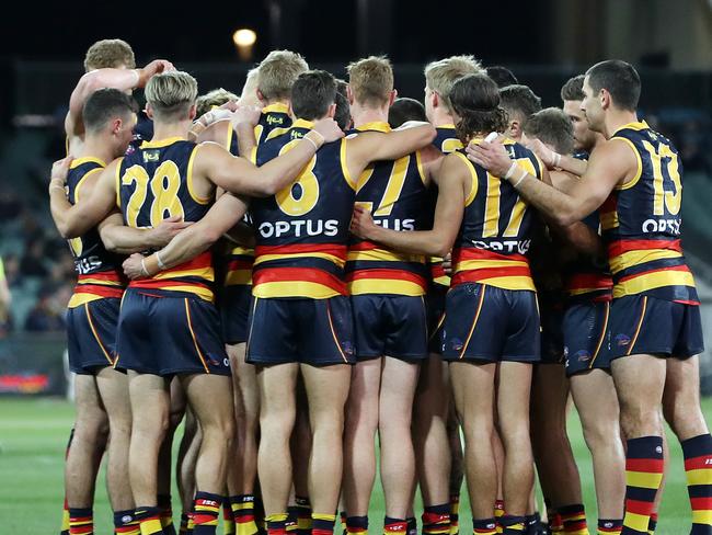 AFL - Wednesday, August 5th, 2020 - Adelaide Crows v Melbourne Demons at the Adelaide Oval. Crows huddle before the start of the game Picture: Sarah Reed