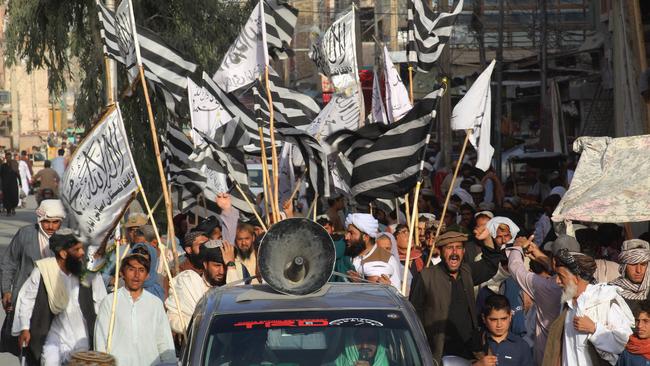 People wave Taliban flags and shout slogans during a rally in Chaman, a town at the Pakistan-Afghanistan border. Picture: AFP