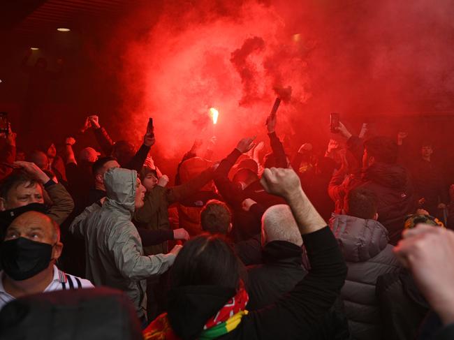 Fans tried to force their way into Old Trafford.