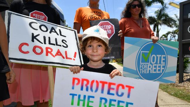 Joah Fanning, 3 from Airlie Beach is seen at a Anti-Adani coal mine protest outside Proserpine Hospital during the visit of Queensland Premier Annastacia Palaszczuk. Picture: AAP Image/Darren England.