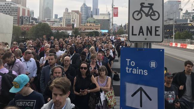 Frustrated commuters wait in line after the Sandringham line was suspended. Picture: Kieran Rooney