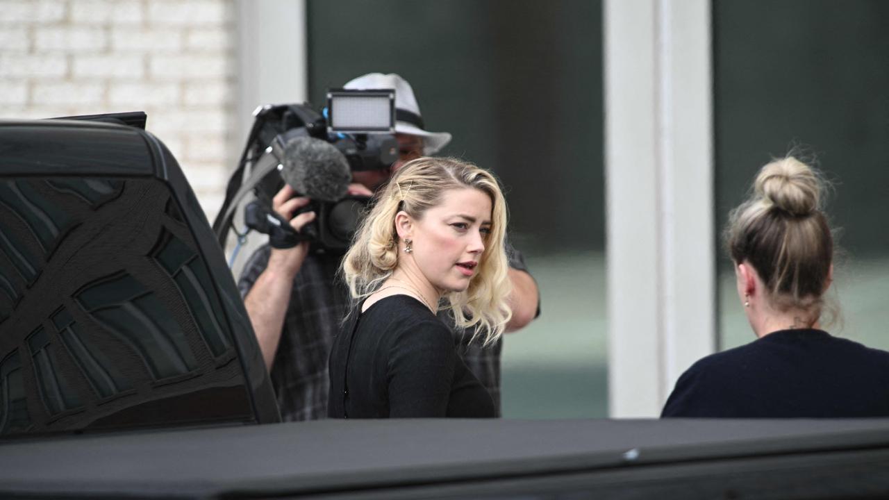 US actress Amber heard and her sister Whitney Heard arrive at the Fairfax County Circuit for the verdict. Picture: Brendan Smialowski / AFP