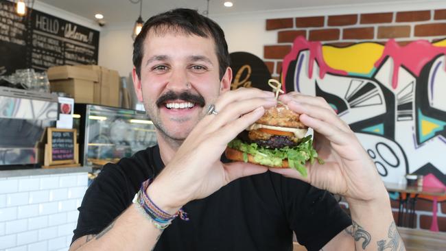 Aner Penava with a Blendlove gluten-free, dairy-free vegan burger. Picture: Richard Gosling