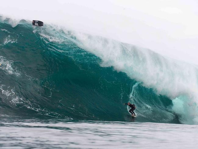 James Hollmer-Cross surfs a monster wave at Shipstern Bluff. Picture: STUART GIBSON