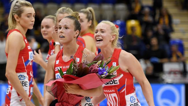 Paige Hadley is congratulated by Tayla Fraser after her 100th game during round three Super Netball match between the NSW Swifts and the Adelaide Thunderbirds.