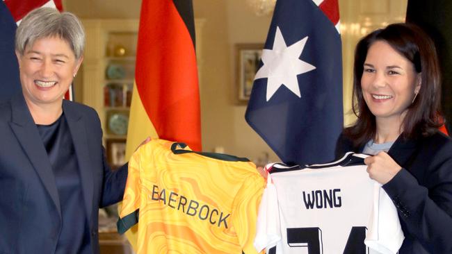 Foreign Affairs Minister Penny Wong (left) exchanging football jerseys with German Foreign Minister Annalena Baerbock at Government House, Adelaide. Picture: Dean Martin