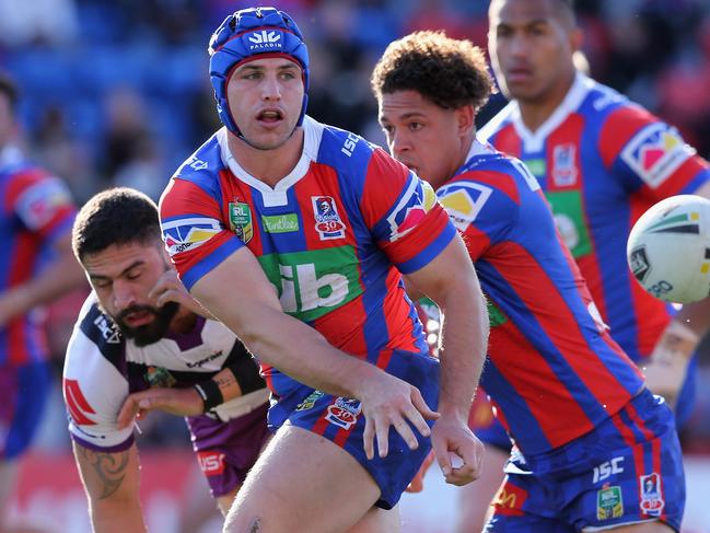 NEWCASTLE, AUSTRALIA - AUGUST 19:  Jamie Buhrer of the Knights passes the ball during the round 24 NRL match between the Newcastle Knights and the Melbourne Storm at McDonald Jones Stadium on August 19, 2017 in Newcastle, Australia.  (Photo by Ashley Feder/Getty Images)