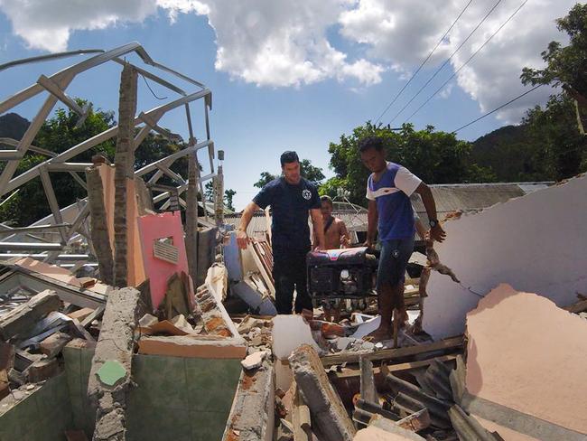 Craig has been helping Indonesian search and rescue and K9 dog teams to search for survivors and victims in the rubble in North Lombok, the worse affected area. Picture: Supplied