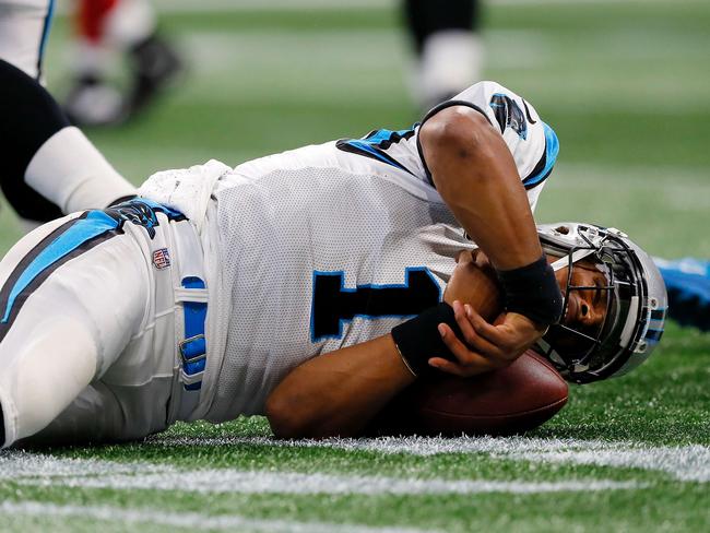 ATLANTA, GA - SEPTEMBER 16: Cam Newton #1 of the Carolina Panthers lays on the ground after a late hit by Damontae Kazee #27 of the Atlanta Falcons during the first half at Mercedes-Benz Stadium on September 16, 2018 in Atlanta, Georgia.   Kevin C. Cox/Getty Images/AFP == FOR NEWSPAPERS, INTERNET, TELCOS & TELEVISION USE ONLY ==