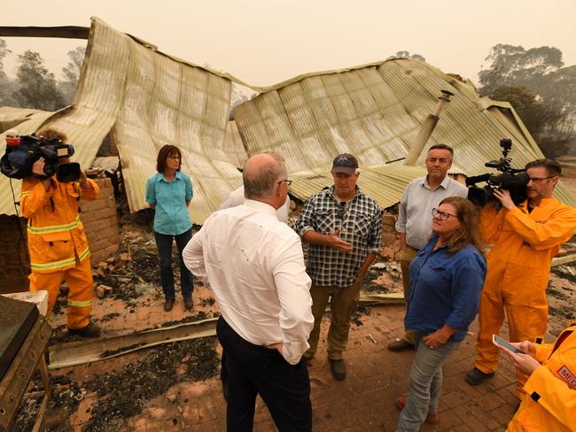 Prime Minister Scott Morrison tours the wildflower farm owned by Paul and Melissa Churchman in Sarsfield on Friday. Picture: AAP