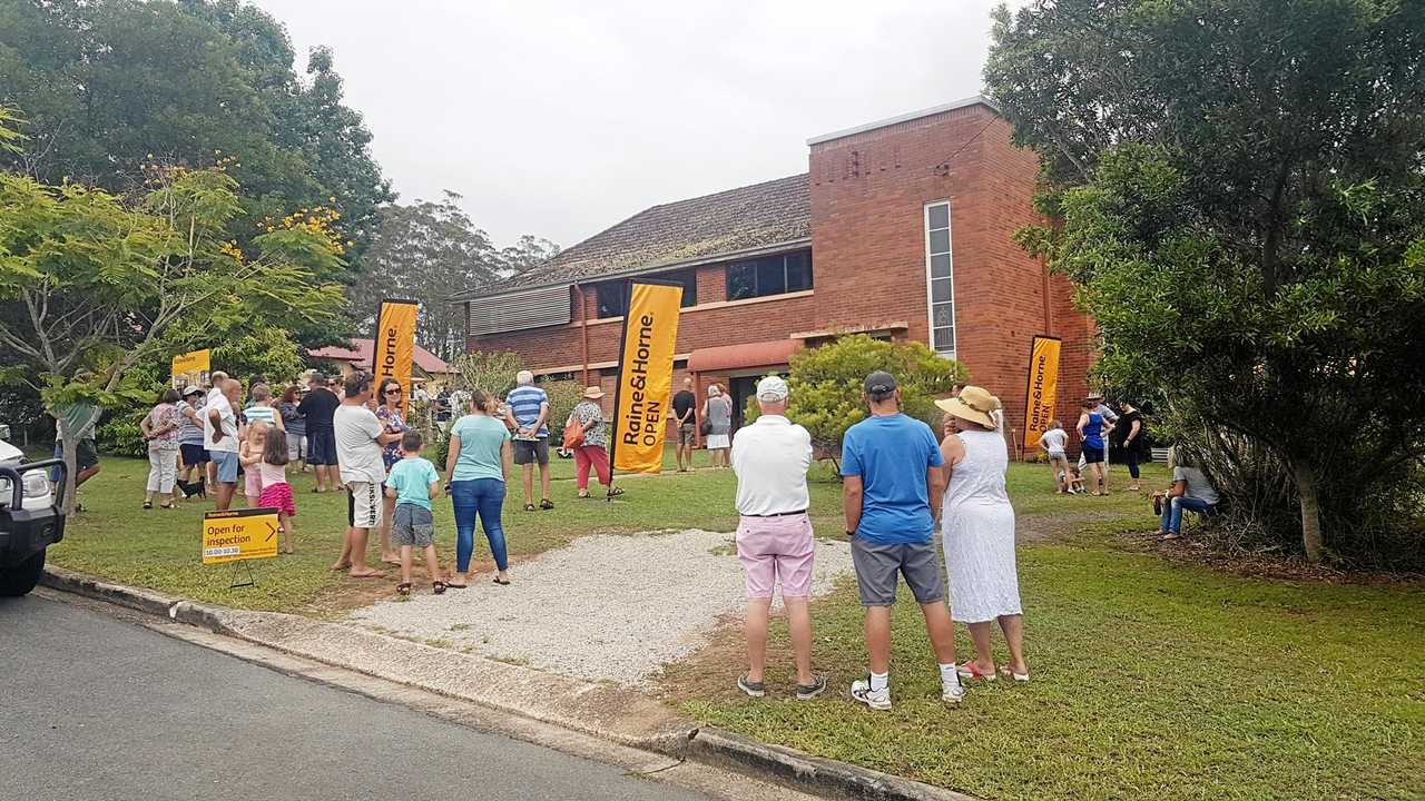 SUNDAY SERVICE: The auction of the former Catholic school now a residential property at 3 Church St, Pomona, drew a good crowd and bidding.