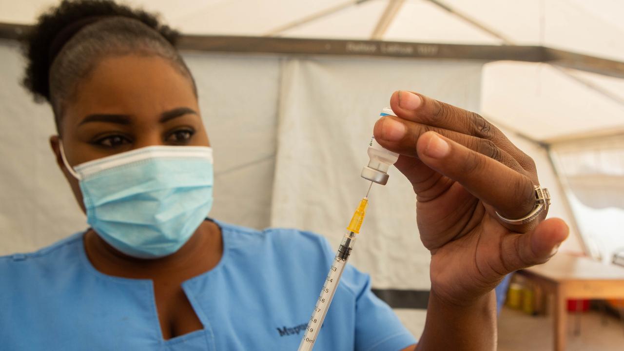 A nurse in Zimbabwe draws out a Covid-19 vaccine before vaccinating a patient on December 01, 2021. Picture: Tafadzwa Ufumeli/Getty Images.