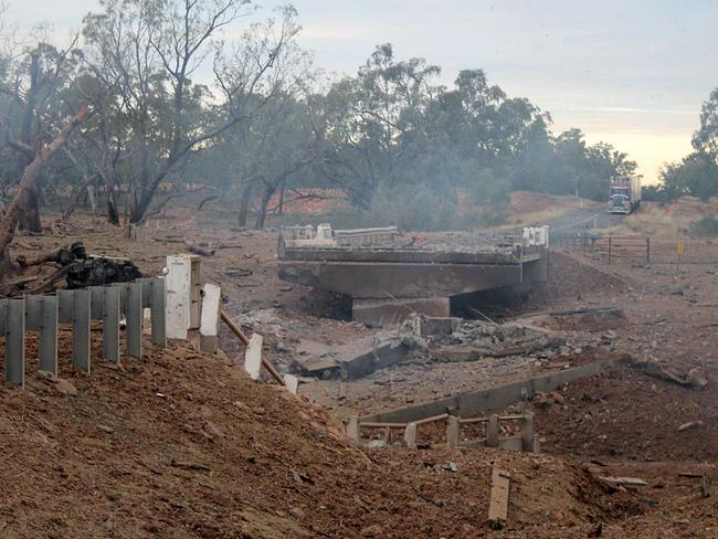 The highway bridge was reduced to a crater.