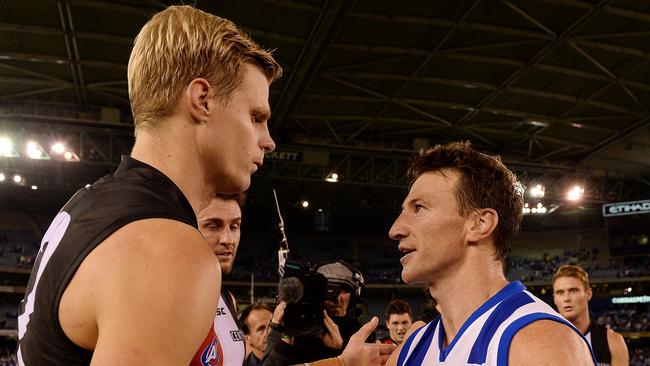 Nick Riewoldt with Brent Harvey.