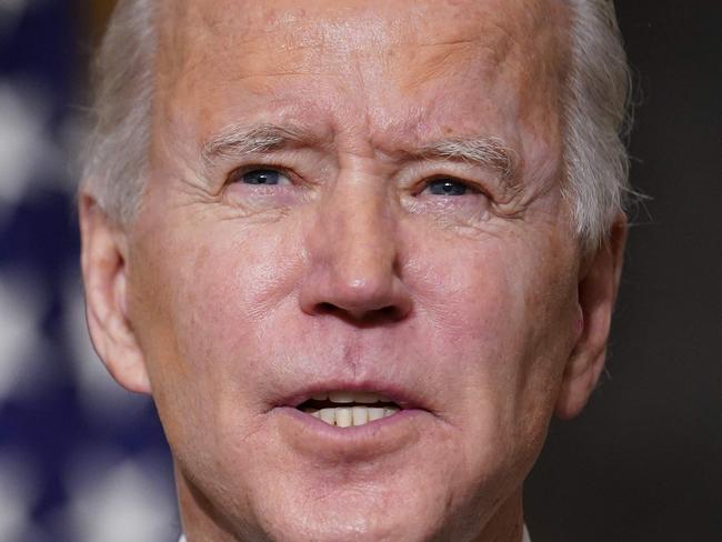 US President Joe Biden speaks on climate change, creating jobs, and restoring scientific integrity before signing executive orders in the State Dining Room of the White House in Washington, DC on January 27, 2021. (Photo by MANDEL NGAN / AFP)