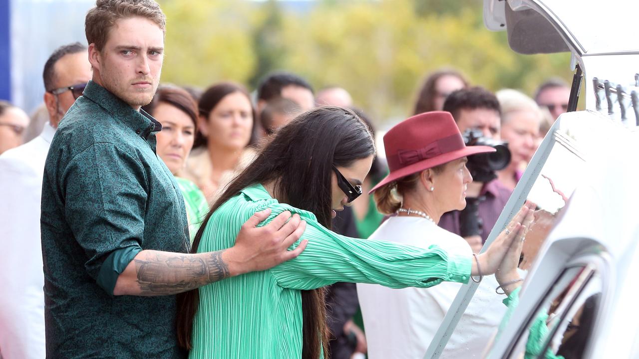 Olyvia’s sister Hope was seen pressing her hand to the hearse window after the 24-year-old’s funeral service. She was comforted by her partner. Picture: NCA NewsWire/ Richard Gosling