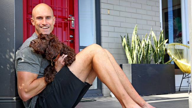 NOVA radio host Ryan 'Fitzy' Fitzgerald pictured at his home in Sydney with recent family addition – spoodle dog Beastie. Picture: Toby Zerna