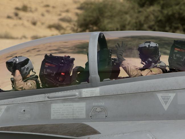 Ready to strike ... the crew of a Royal Australian Air Force F/A-18F Super Hornet on the taxiway prior to their first combat mission in Iraq. Picture: Supplied