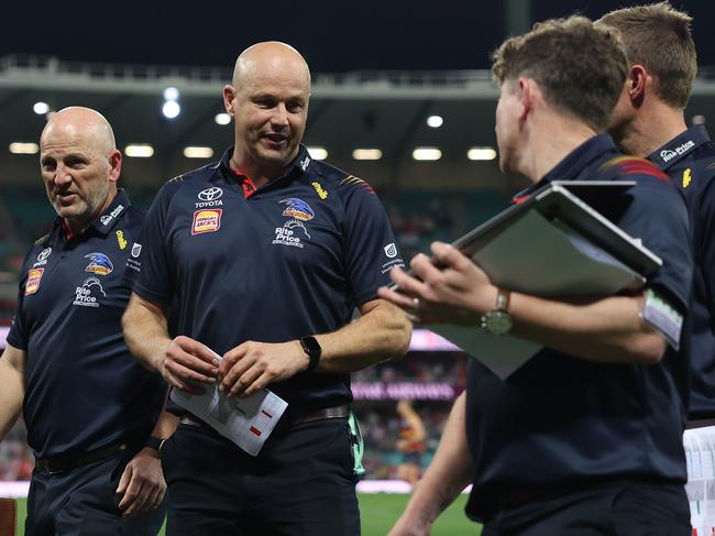 SYDNEY, AUSTRALIA - AUGUST 24: Matthew Nicks, Senior Coach of the Crows talks to coaches after defeat during the round 24 AFL match between Sydney Swans and Adelaide Crows at Sydney Cricket Ground, on August 24, 2024, in Sydney, Australia. (Photo by Mark Metcalfe/AFL Photos/via Getty Images)