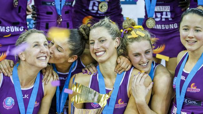 Laura Geitz of the Firebirds celebrates with team mates after winning the grand final match of the ANZ Championship between the Queensland Firebirds and the NSW Swifts at the Brisbane Entertainment Centre in Brisbane, Sunday, July 31, 2016. (AAP Image/Glenn Hunt) NO ARCHIVING, EDITORIAL USE ONLY