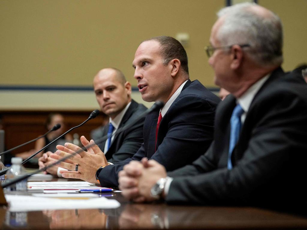 Grush was joined by Ryan Graves, executive director of Americans for Safe Aerospace and Retired Navy Commander David Fravor. Picture: AFP