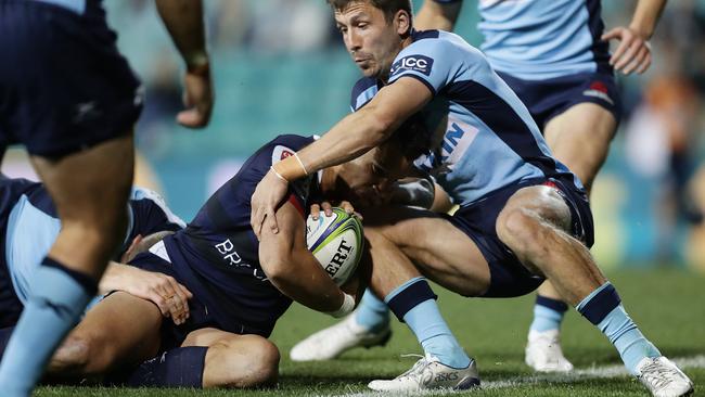 Matt Toomua of the Rebels scores a try during the round-9 Super Rugby AU match between the Waratahs and the Melbourne Rebels at Leichhardt Oval on Saturday. Picture: Mark Metcalfe/Getty Images