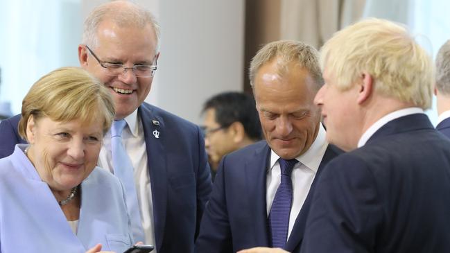 Prime Minister Scott Morrison shares a lighter moment with world leaders at the G7 in Biarritz, France on Monday. Picture: Adam Taylor