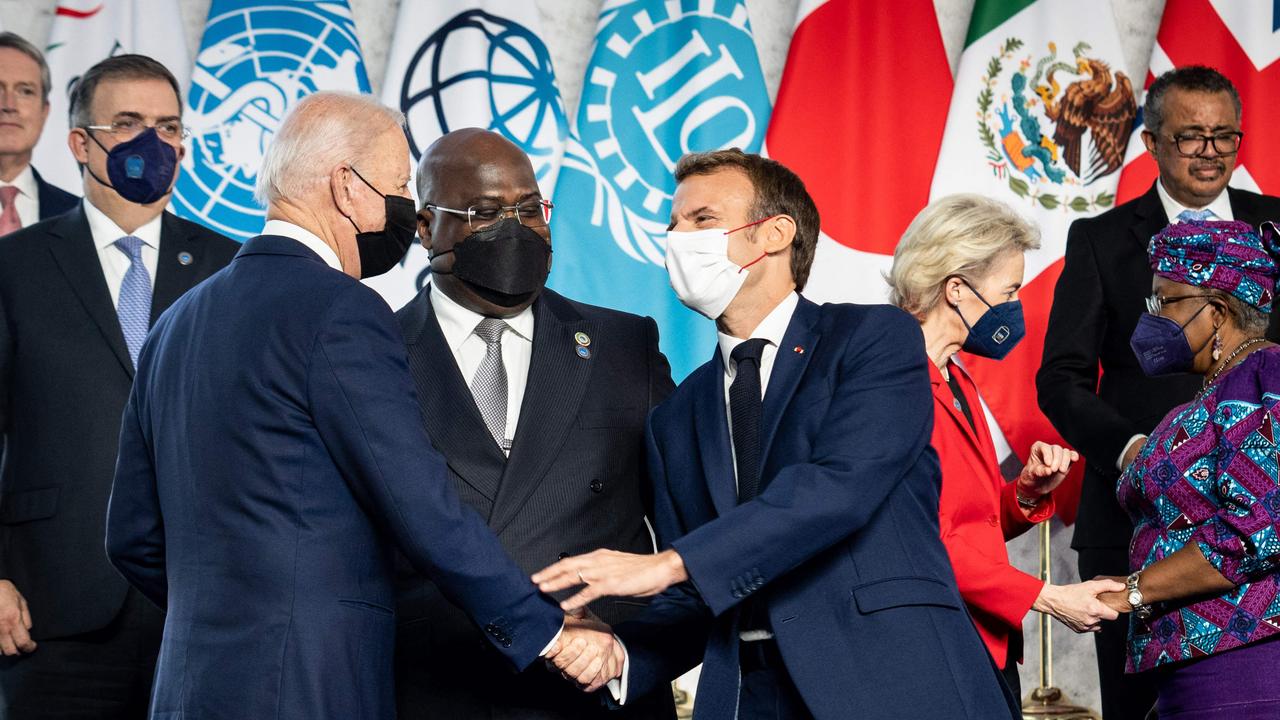 US President Joe Biden and French President Emmanuel Macron shake hands during a group photo at the G20 of World Leaders Summit on October 30, 2021. Picture: Erin SCHAFF / POOL / AFP