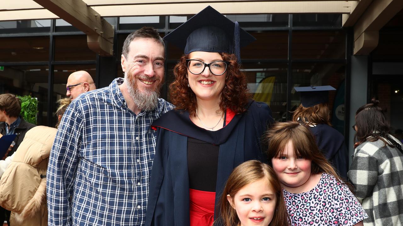 Deakin graduate Ashleigh Dalton with husband Clinton and their daughters Grace, 9 and Annie, 7. Picture: Alison Wynd