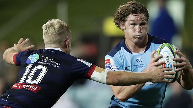 SYDNEY, AUSTRALIA - AUGUST 29: Michael Hooper of the Waratahs Is tackled by Andrew Deegan of the Rebels during the round nine Super Rugby AU match between the Waratahs and the Melbourne Rebels at Leichhardt Oval on August 29, 2020 in Sydney, Australia. (Photo by Mark Metcalfe/Getty Images)