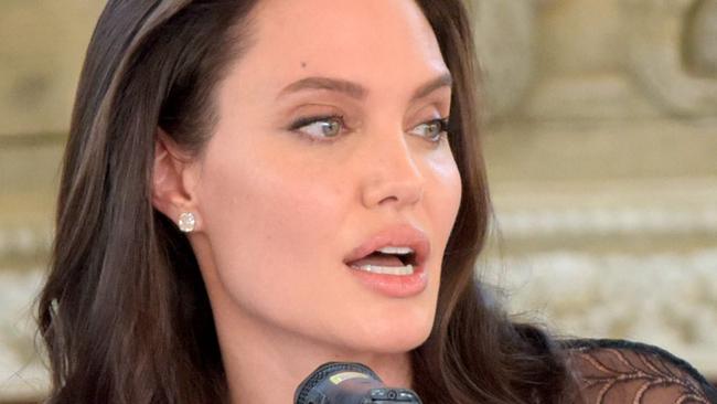 Hollywood star Angelina Jolie speaks to media during a press conference at a hotel in Siem Reap on February 18, 2017.  Angelina Jolie will unveil her new film on the horrors of the Khmer Rouge era on February 18 at the ancient Angkor Wat temple complex in Cambodia, a country the star shares a deep affinity with through her adopted son Maddox. / AFP PHOTO / TANG CHHIN SOTHY