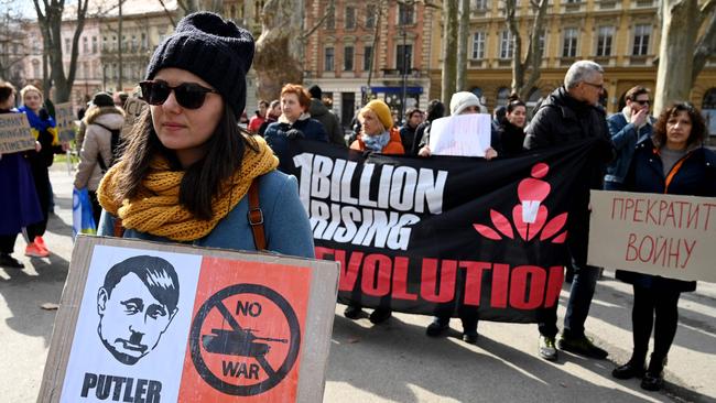 A protester in Zagreb throws the neo-Nazi slur back at Vladimir Putin. Picture: AFP