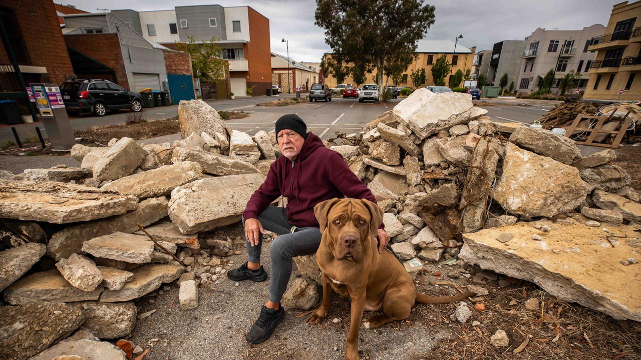 Port Adelaide resident Alan Bennet with his dog Floyd in front of dumped construction waste on McLaren Pde Picture: Tom Huntley