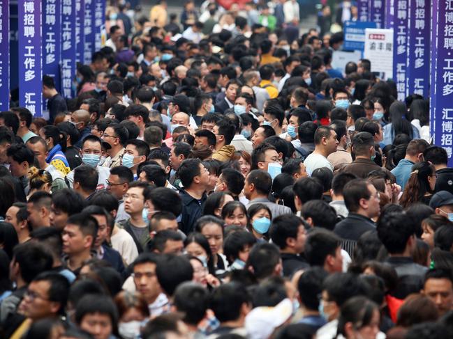 People attend a job fair in China's southwestern city of Chongqing on April 11, 2023.