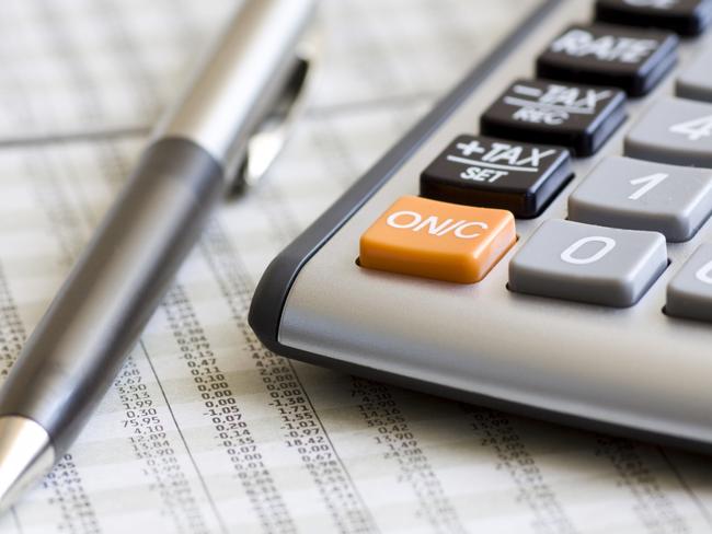 06/07/2012 BUSINESS: Balancing the accounts. Calculator, pen, tax return Pic. Thinkstock