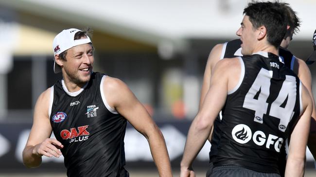 Port Adelaide’s Cam Sutcliffe, left, during a Port Adelaide training session at Alberton Oval. Picture: AAP Image/Sam Wundke