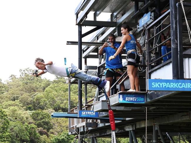 Australia's first female jump master throws AJ Hackett off the tower